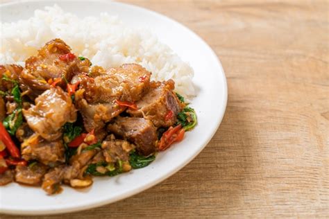 Premium Photo Stir Fried Crispy Pork Belly And Basil With Rice