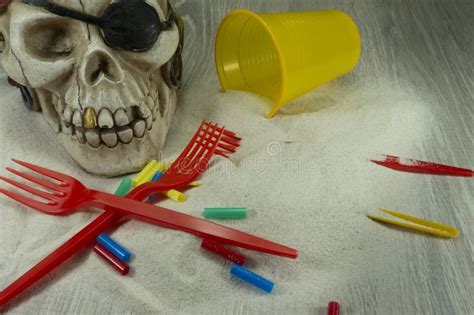 Pirate Skull Toy With Plastic Forks And The Sand Stock Photo Image Of