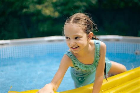 Premium Photo | Little girl lying on pool float