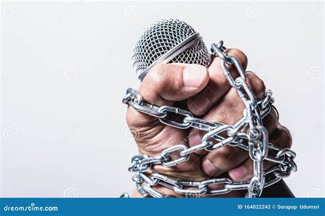 Hand Holding Microphone And Have Chain On Fist Hand On White Background