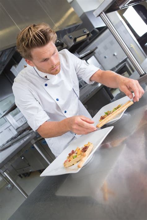 Chef Presenting Food On Plate Stock Photo Image Of Uniform