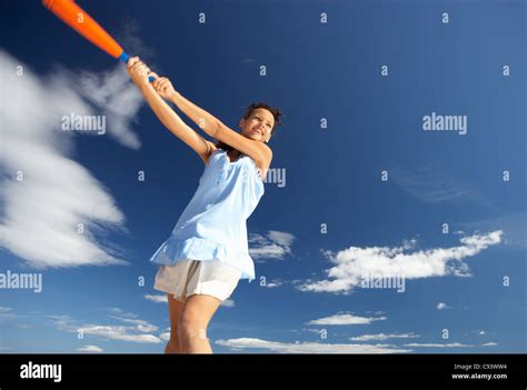 Teenage Girl Playing Baseball On Beach Stock Photo Alamy