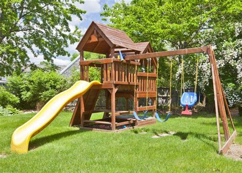 Beautifully Manicured Backyard With Large Two Story Playhouse With