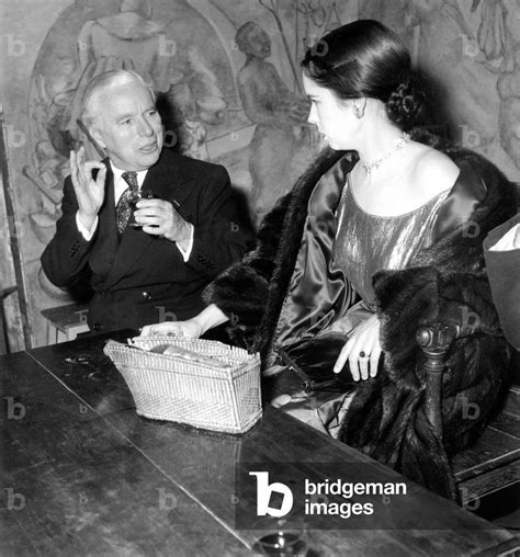 Charlie Chaplin With His Wife Oona Dining At Famous Parisian Restaurant Tour Dargent October