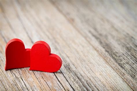 Premium Photo Red Heart Shaped On Wooden Table