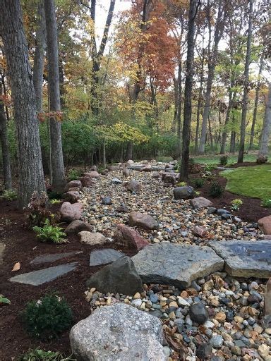 Functional Dry Creek With Landscaping Creates A Visually Appealing