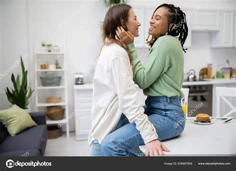 Happy Lesbian African American Woman Sitting Dining Table Hugging