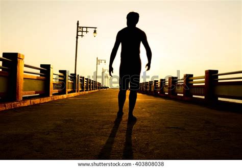 Silhouette Man Walking Sunset Stock Photo Shutterstock