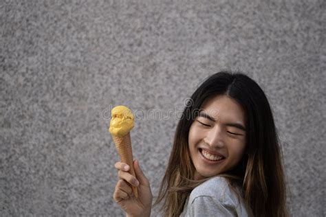 Happy Gay Male With A Yellow Ice Cream And Copy Space Stock Image Image Of Ethnic Icecream