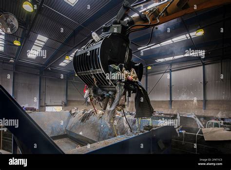 Mechanical Grabber At Work In A Recycling Plant In England Stock Photo