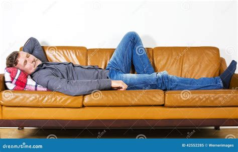 man laying  couch stock image image  male comfortable