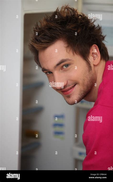 Man Raiding The Fridge Stock Photo Alamy