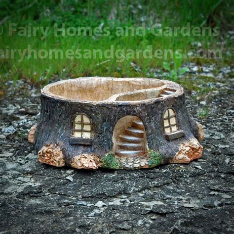 a tree stump with a house built into it
