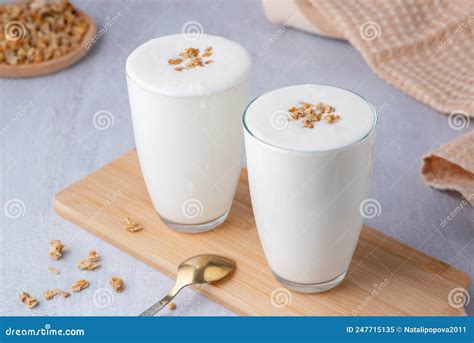 Kefir Buttermilk Or Yogurt With Granola Yogurt In Glass On Wooden Background Stock Image