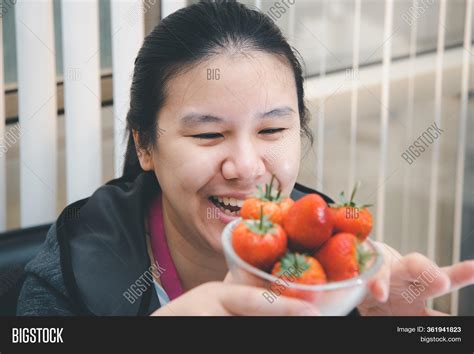 woman eat strawberry image photo  trial bigstock