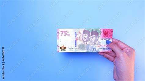 Indonesian Rupiah The Official Currency Of Indonesia Woman S Hand Is