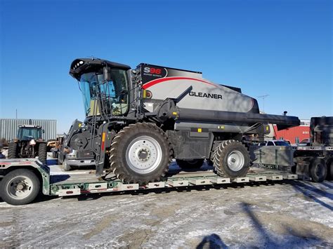 A brand new Gleaner S96 Super Combine arrives at the dealership Allis Chalmers Tractors, Farm ...