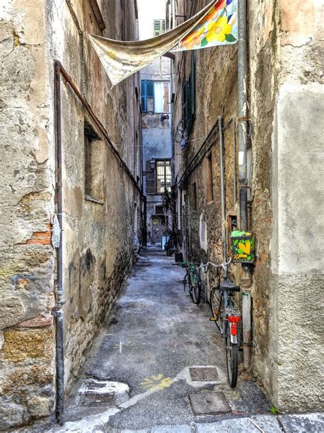 A Typical Ligurian Alley Italy Called `caruggio` With Flower Pots