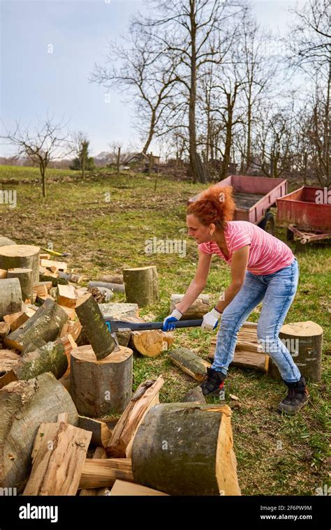 Woman Splitting Firewood Hi Res Stock Photography And Images Alamy