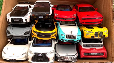 Box Full Of Model Cars Porsche Taycan GTR R35 Toyota AE86 Rolls