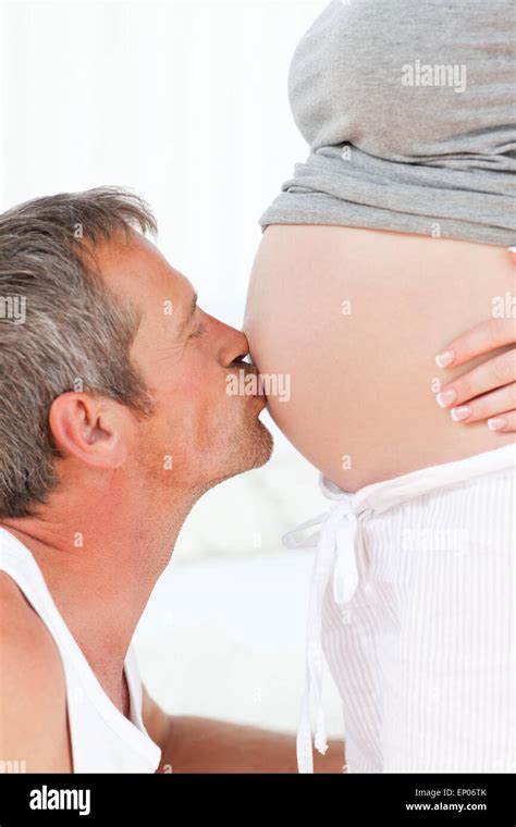 Man Kissing His Wife S Belly Stock Photo Alamy