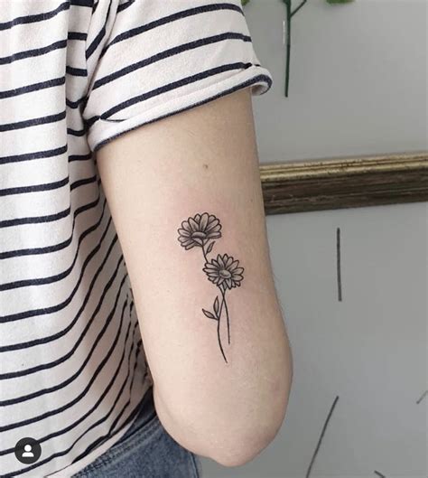 Daisy minimalist tattoo | Classy tattoos, Minimalist tattoo, Cute tattoos