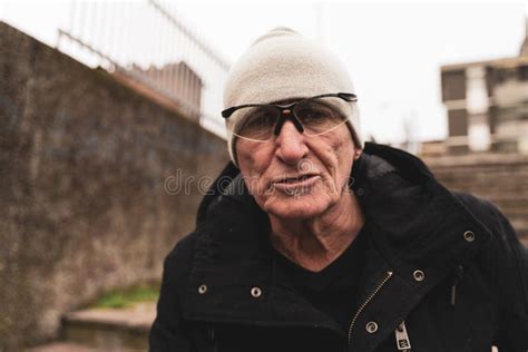 Mature Man Rap Singer Posing In The Street On The Outskirts Of A City