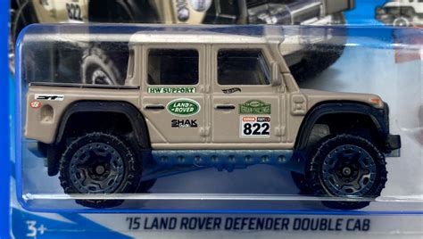 Машинка Базова Hot Wheels Land Rover Defender Double Cab Hot Trucks FJV Tan купити