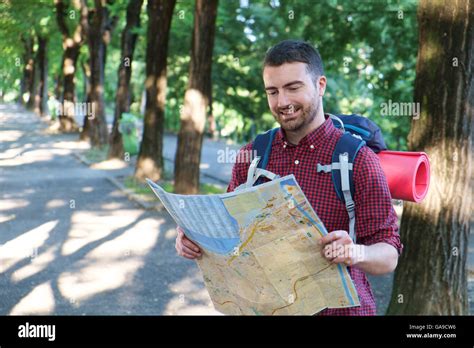 Man With A Map Exploring Outdoors Stock Photo Alamy