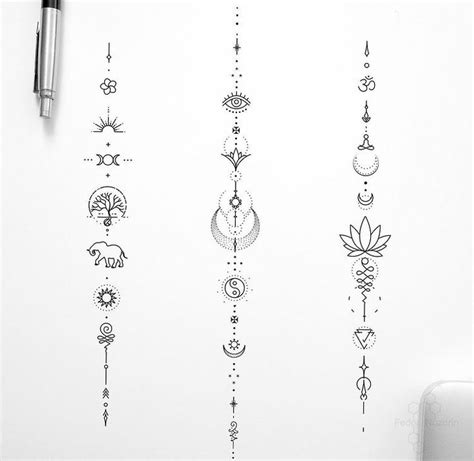 An Assortment Of Tattoos On A White Wall Next To A Pen And Paper With Ink