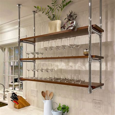 A Ceiling Hung Studio Style Bistro Shelving Unit In Polished Chrome By