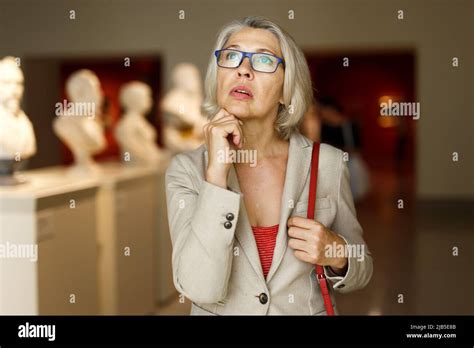 Mature Woman Visiting Museum Stock Photo Alamy
