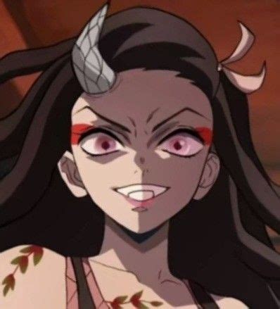 A Woman With Long Hair And Horns On Her Head Is Staring At The Camera