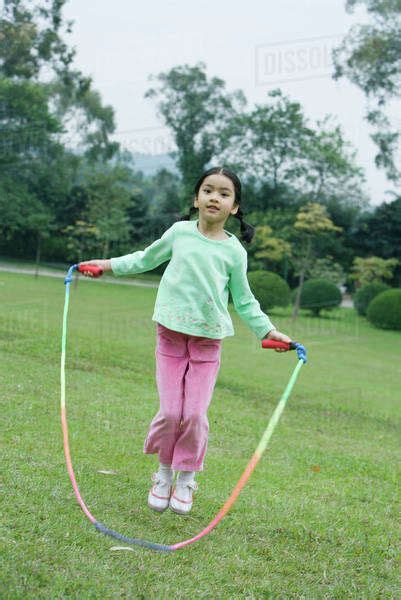 Little Girl Playing With Jumping Rope Stock Photo Dissolve