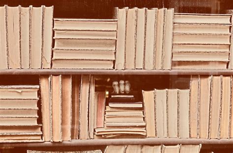 Premium Photo Stack Of Books On Shelf