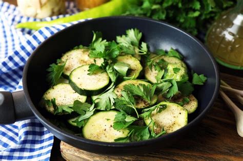 Premium Photo Sliced Zucchini In Pan On Table Closeup