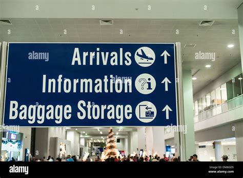 Direction Sign For Arrivals Information And Baggage Storage On Manila