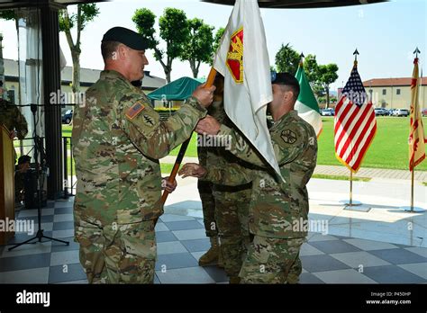 Capt Harrison M Zabell Center Passes The Guidon To Col Steven M