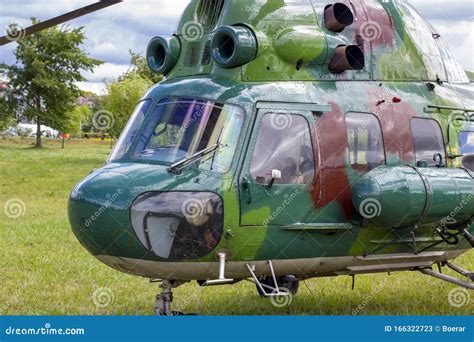 Green Military Helicopter is Landing in the City Street Park. Stock ...