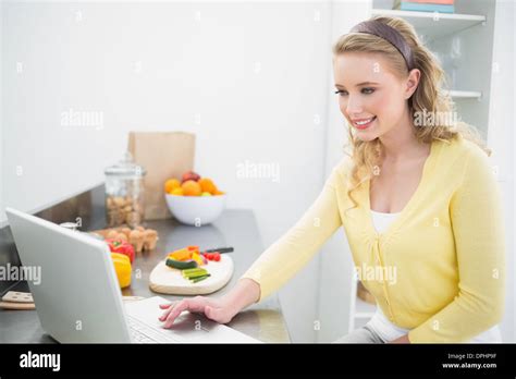 Happy Cute Blonde Using Laptop Stock Photo Alamy