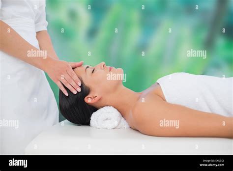 Beautiful Brunette Enjoying A Head Massage Stock Photo Alamy