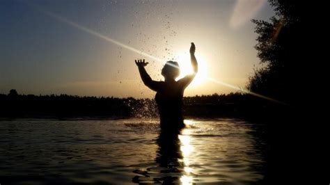 Premium Photo Silhouette Woman Splashing Water In Lake Against Sky At