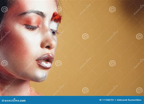 Fashion Portrait Of A Dark Skinned Girl With Silver Foil Make Up