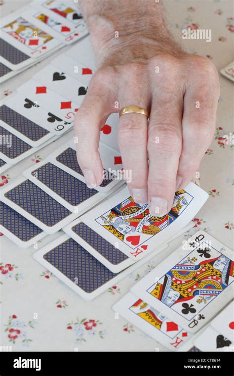 Senior Playing Solitaire Stock Photo Alamy