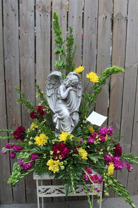 Angel In Fresh Flower Arrangement Funeral Flower Arrangements