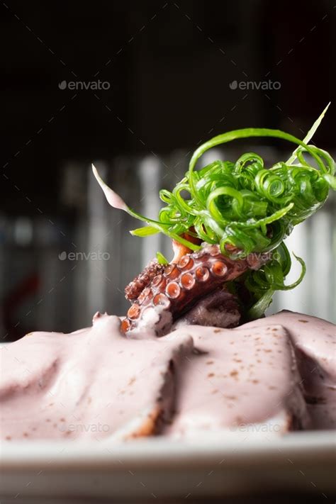 Octopus Carpaccio With An Olive Sauce Peruvian Style Dish Stock Photo