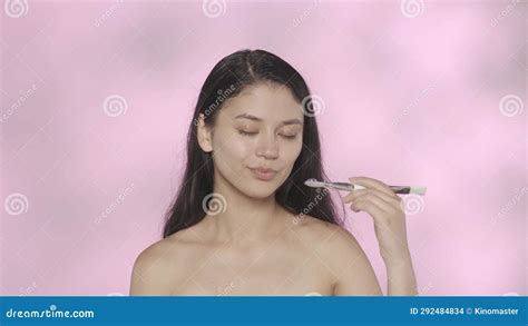 Closeup Studio Shot Of Beautiful Female Model Brunette Girl With Natural Makeup And Long Hair