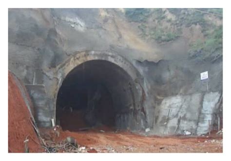 Tunnel collapse. (a) Failure shotcrete, (b) deformed tunnel, (c ...