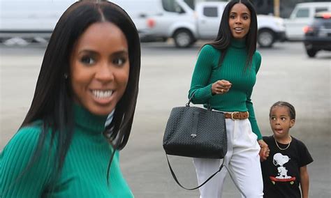 Kelly Rowland Cuts A Chic Figure In Green Mock Neck Top And Tailored