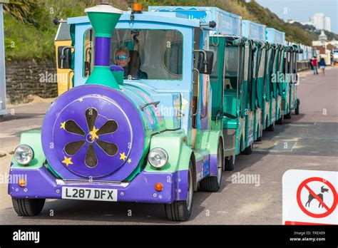 A Land Train Takes People For Rides Along The Seafront Promenade At